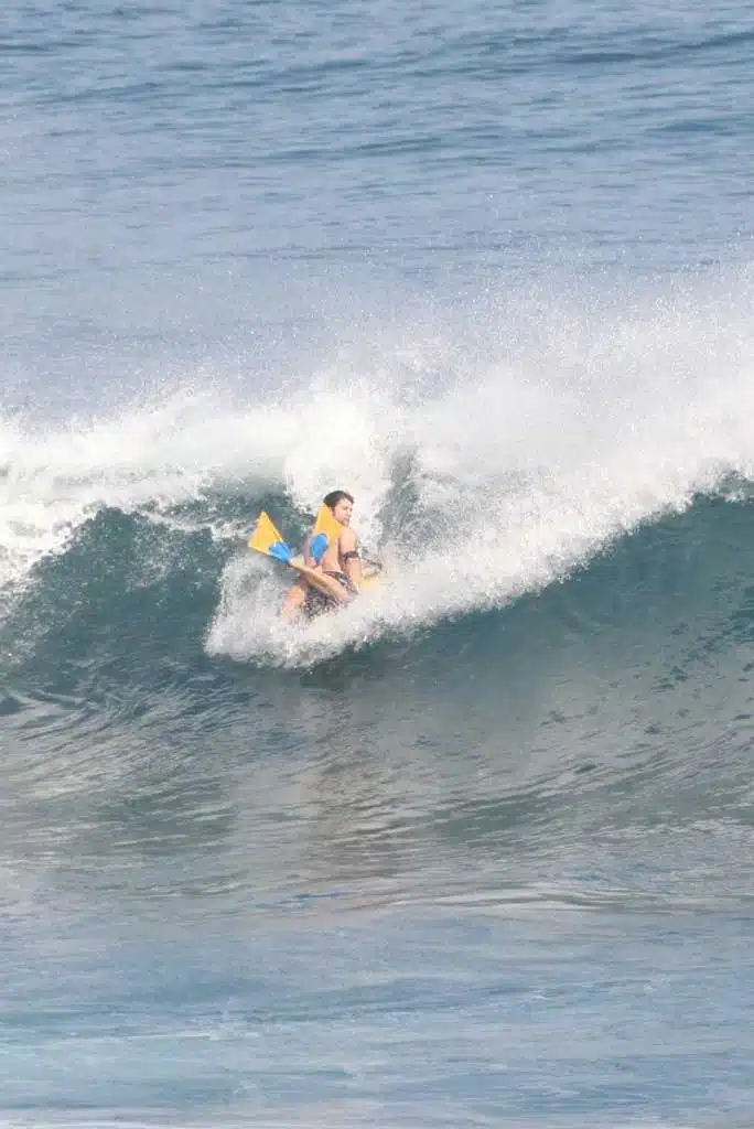 Beginner bodyboarder catching a first wave with Sea Krew in Ericeira