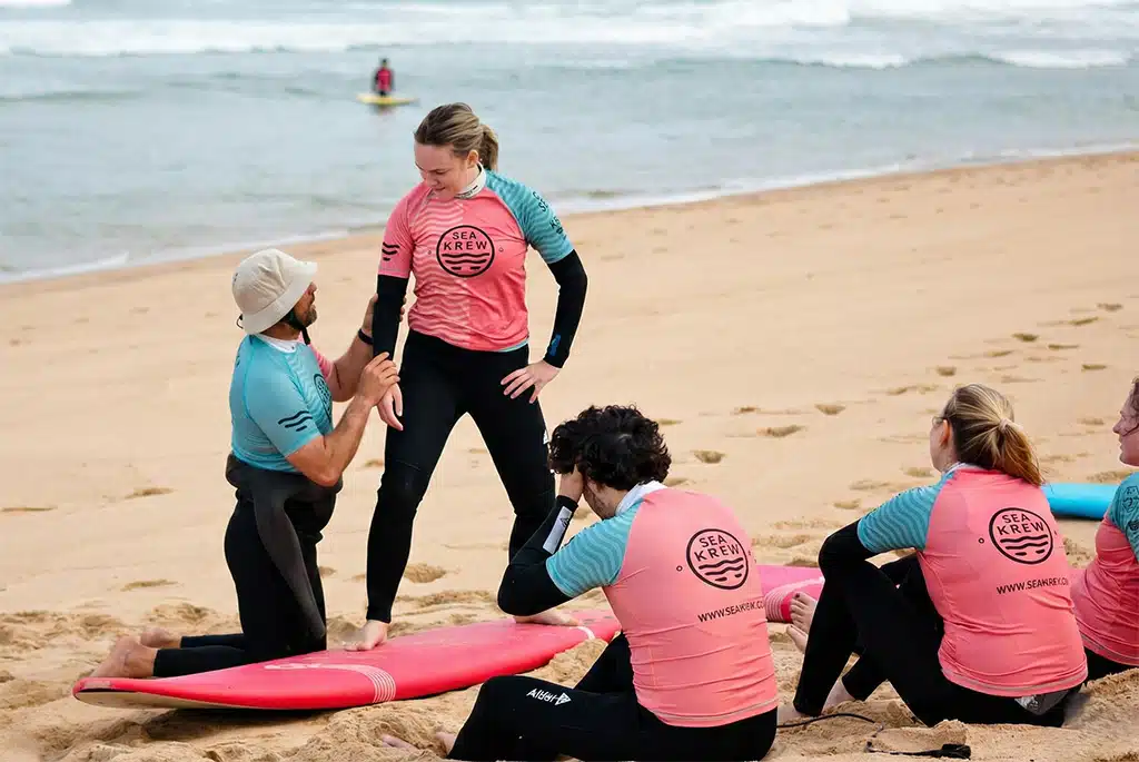 Sea Krew guests learning how to surf with qualified instructors