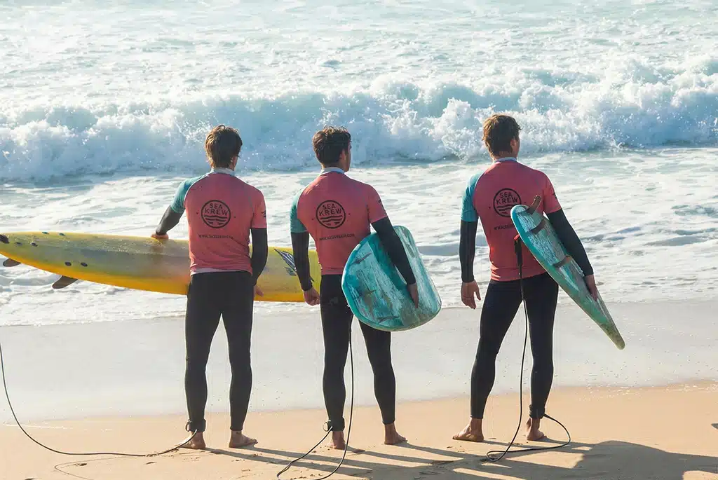 Surf students ready for a coached session in Ericeira, Portugal