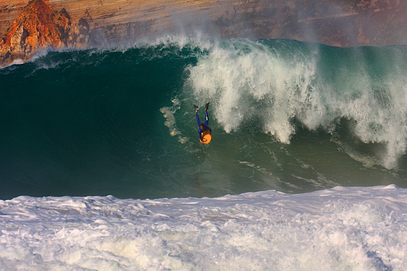 Rui Ferreira performing high level bodyboard maneuver as professional athlete