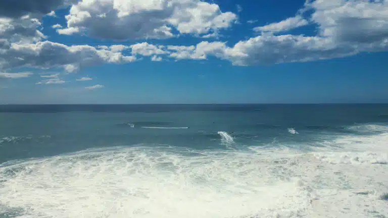 Aerial drone view of surfers on Ericeira waves – Sea Krew surf camp Portugal World Surf Reserve