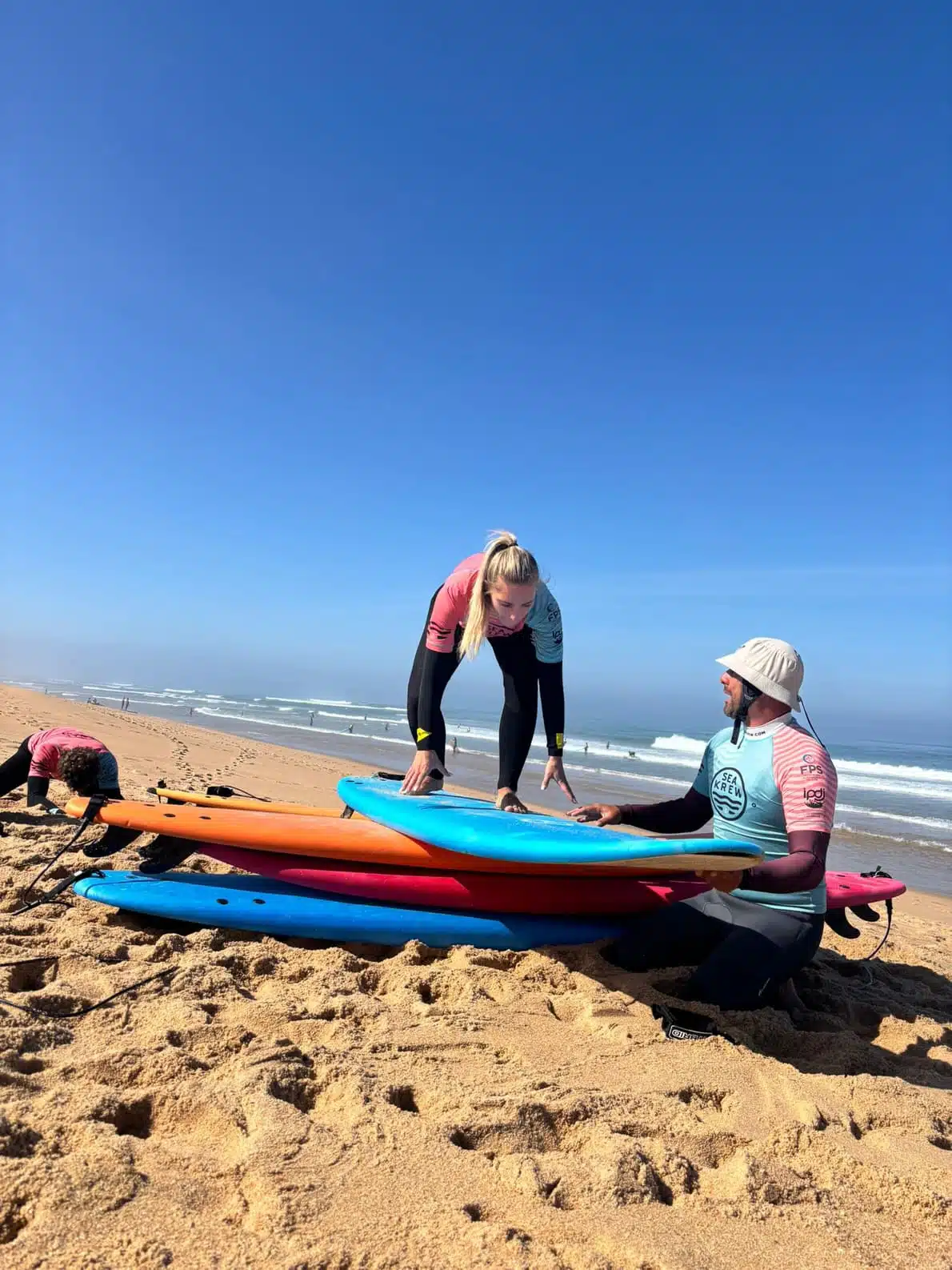 Sea Krew coach Rui giving surf lesson on Ericeira beach Portugal