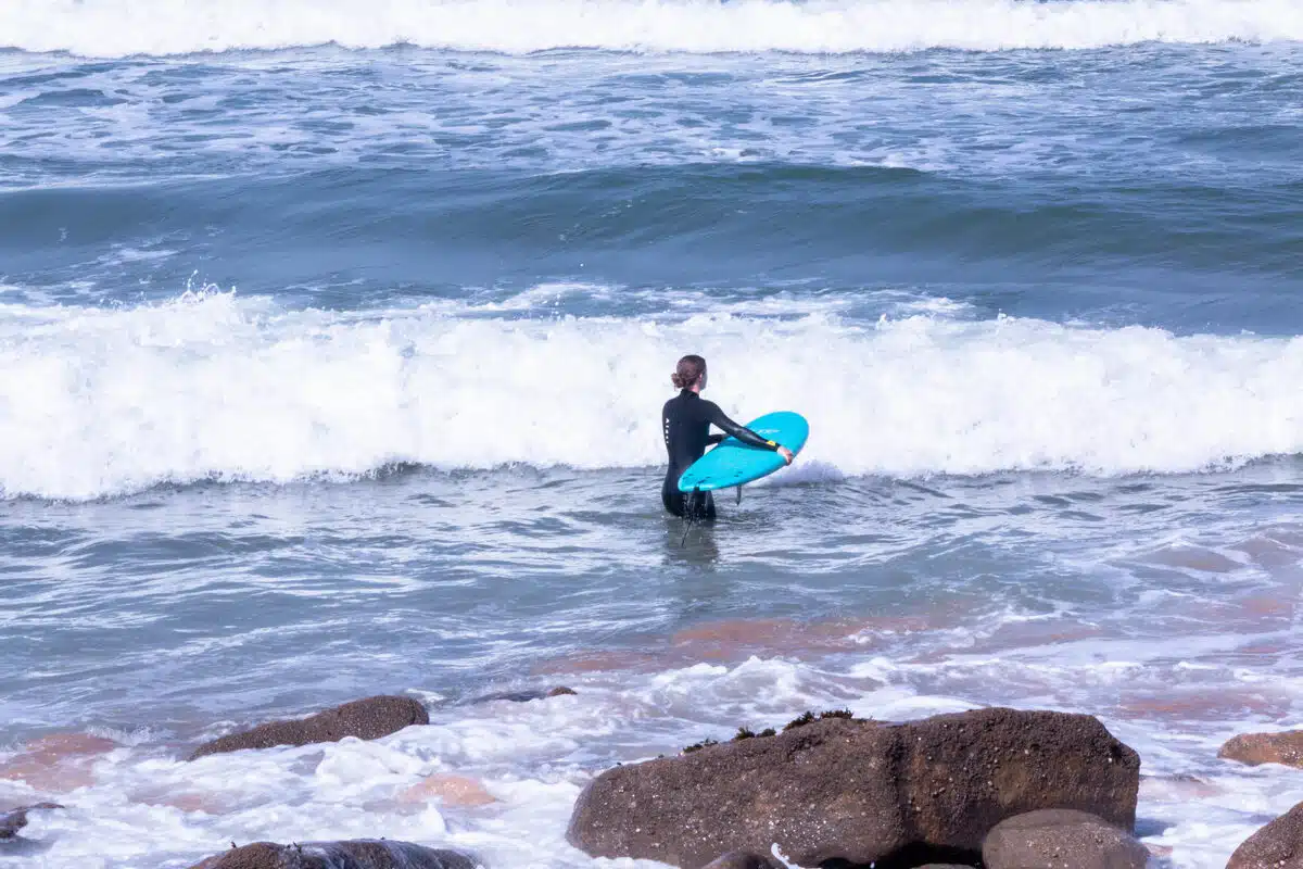 Beginner surfer on Portugal coast during Sea Krew surf lesson Ericeira