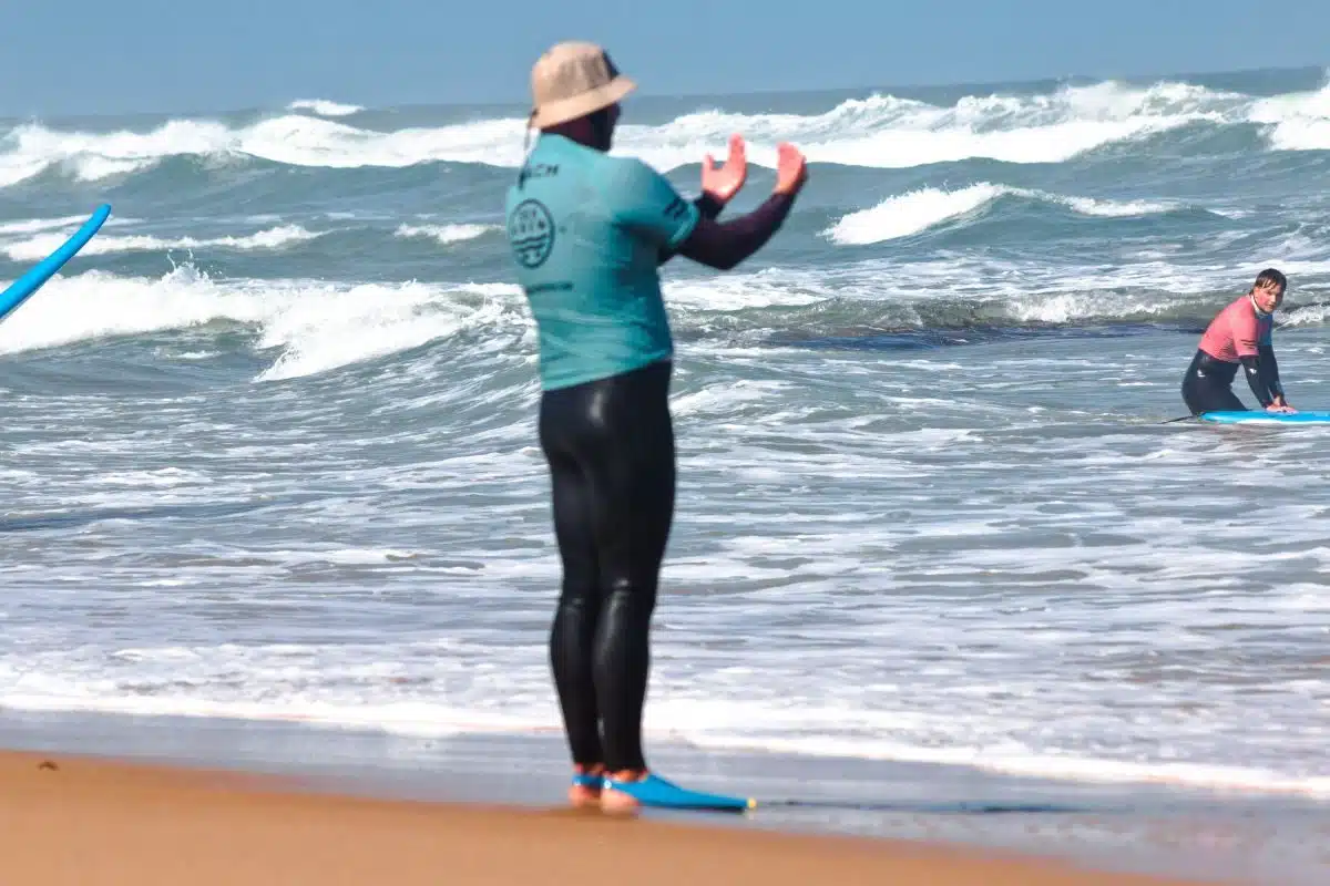 Beginner surf lesson safety briefing on the beach in Ericeira