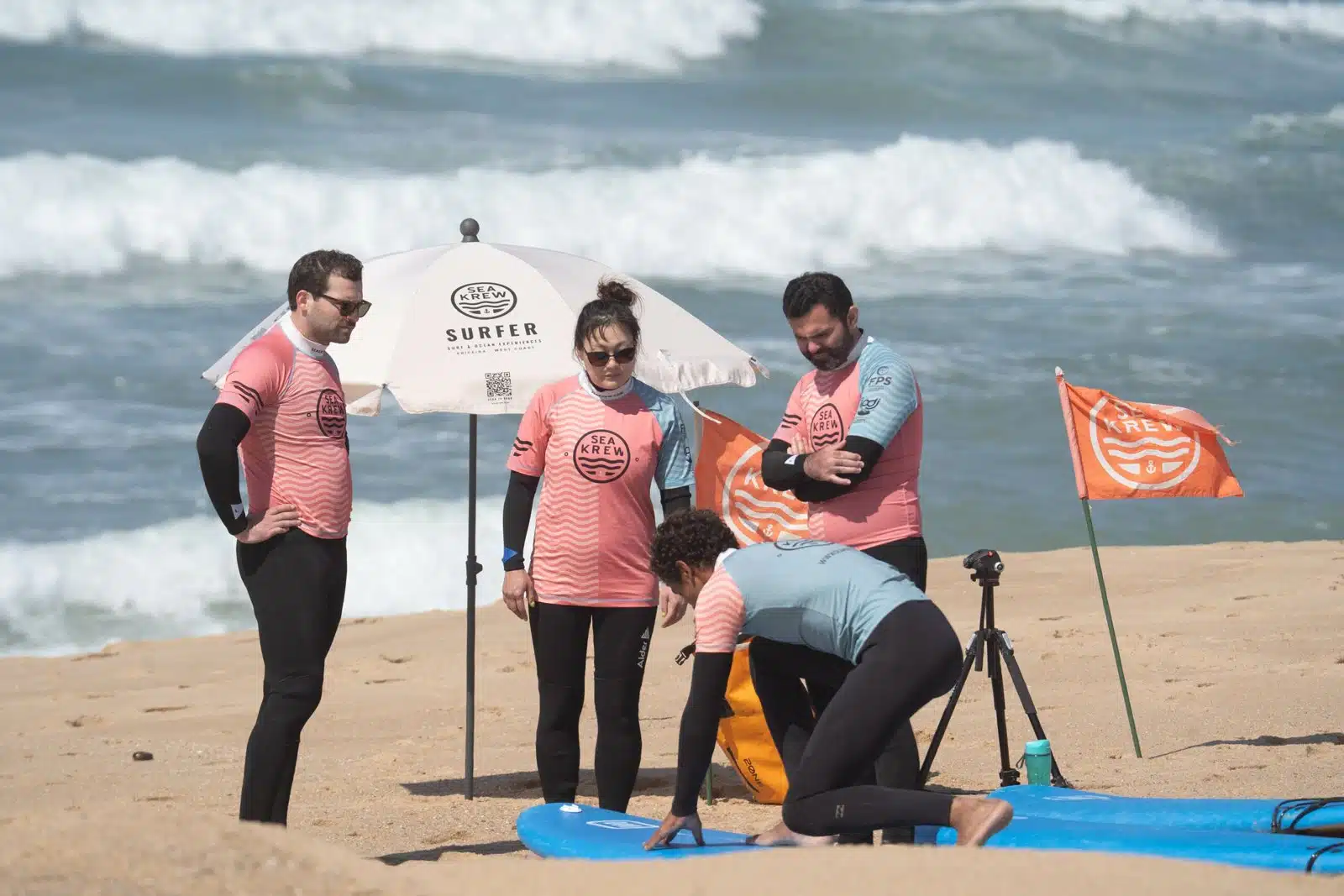 Sea Krew surf coach giving the beach safety briefing before a beginner surf lesson in Ericeira