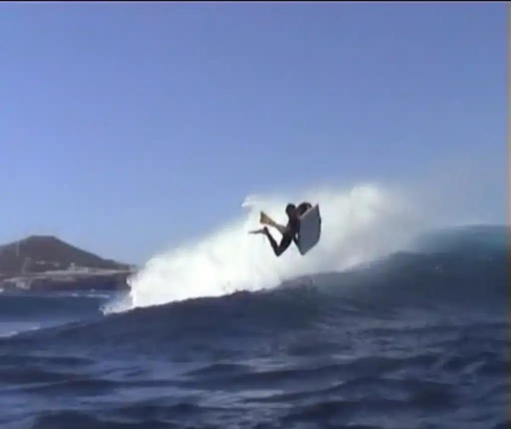 Bodyboarder launching an air off the lip